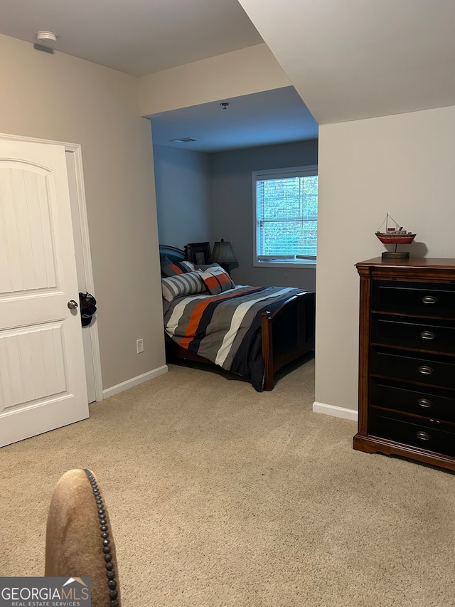 bedroom with light carpet