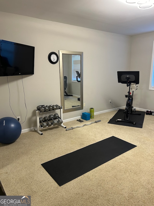 exercise room featuring carpet