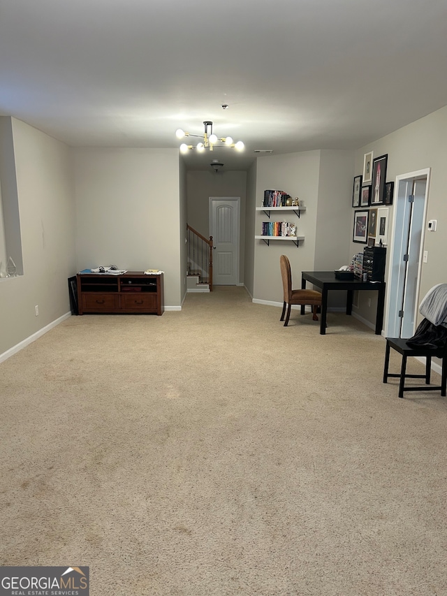 living area with light colored carpet and an inviting chandelier