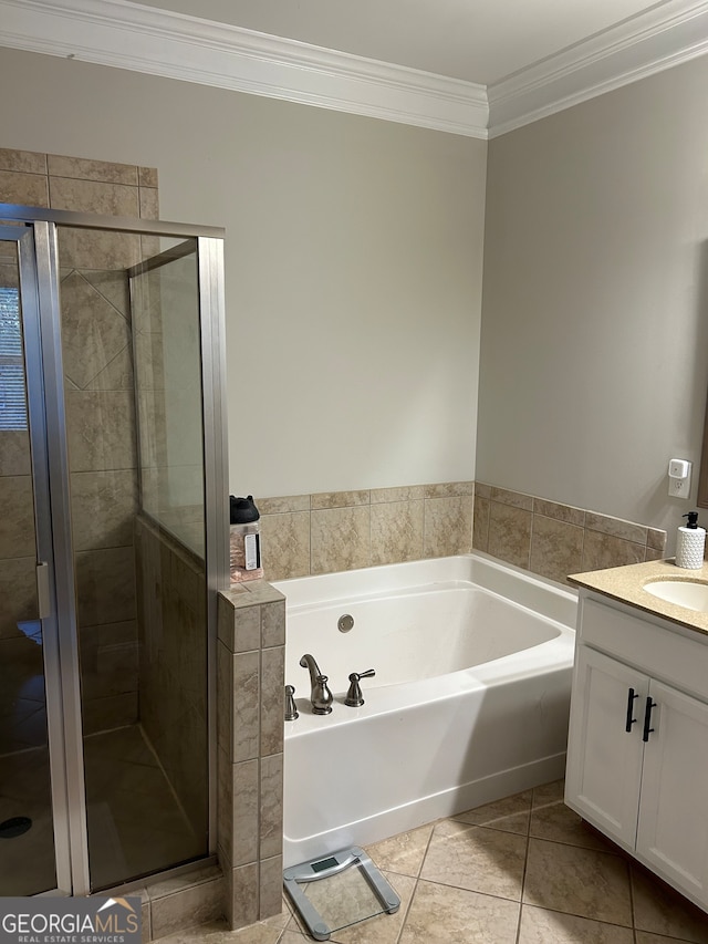 bathroom with plus walk in shower, vanity, tile patterned floors, and ornamental molding