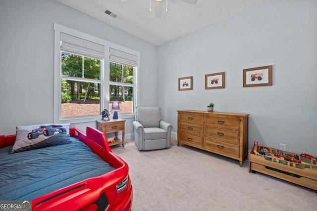 bedroom with light carpet and ceiling fan