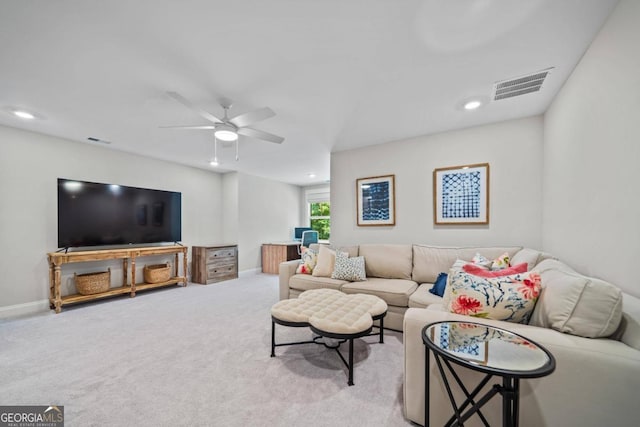 living room with ceiling fan and light carpet