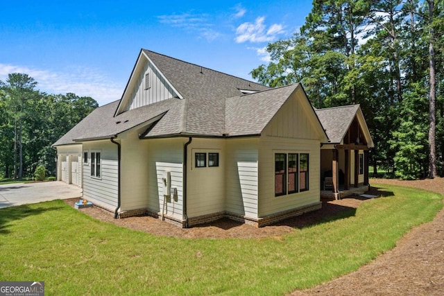 view of side of property with a yard