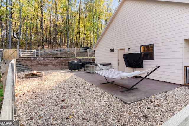 view of patio featuring an outdoor fire pit