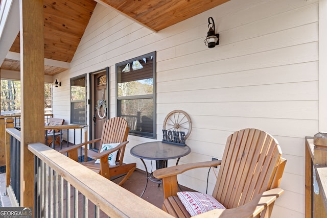 wooden terrace with a porch