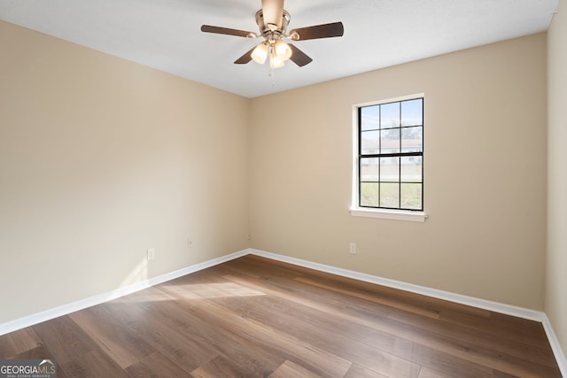 empty room featuring ceiling fan and wood-type flooring