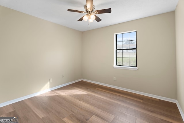 spare room featuring ceiling fan and light hardwood / wood-style floors