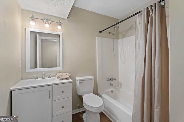 full bathroom featuring shower / bathtub combination with curtain, vanity, a textured ceiling, and toilet