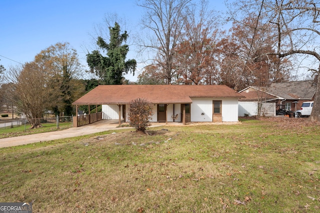 ranch-style home with a carport and a front lawn