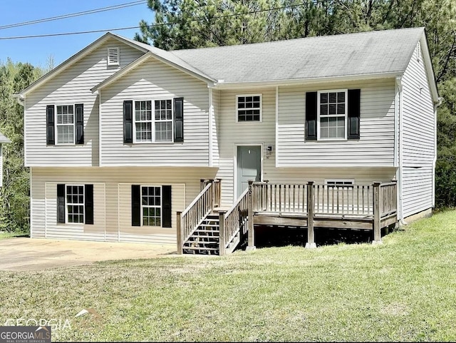 bi-level home featuring a wooden deck, a patio area, and a front lawn