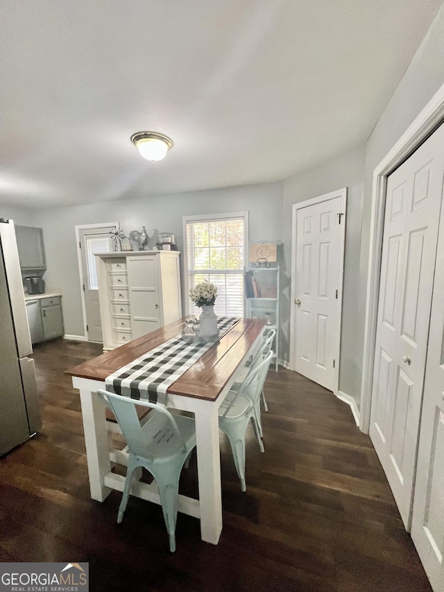 dining area with dark wood-type flooring