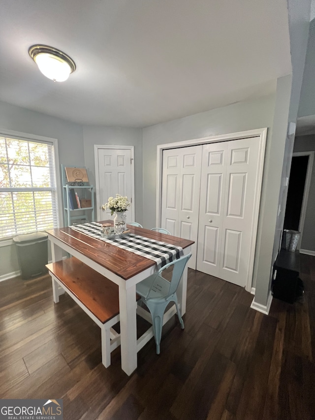 dining area featuring dark hardwood / wood-style flooring