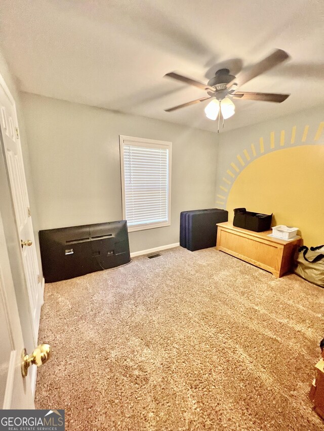 carpeted bedroom with ceiling fan