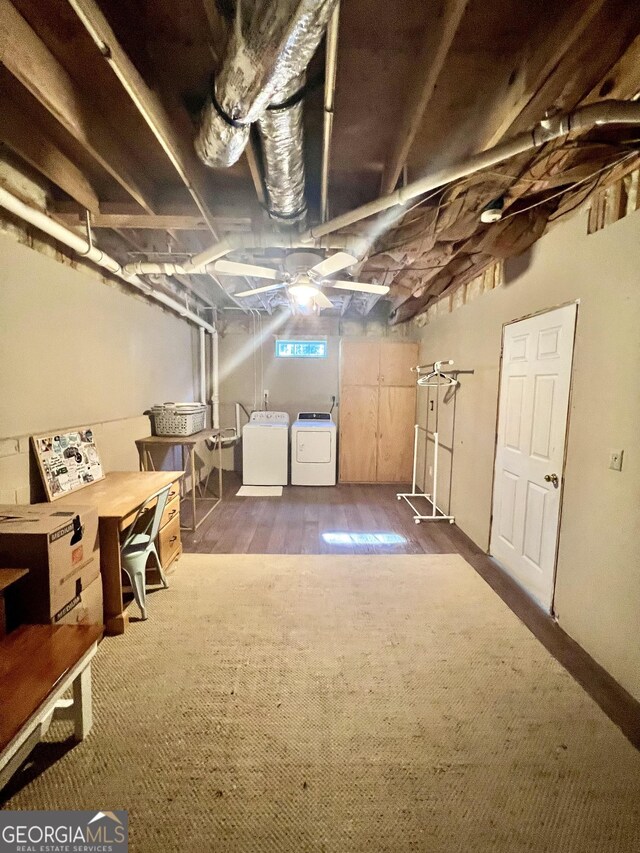 basement featuring dark hardwood / wood-style floors and washer and clothes dryer