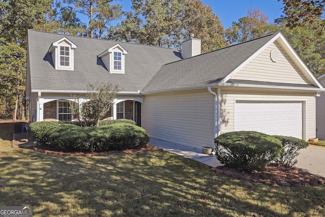 cape cod home featuring a front yard