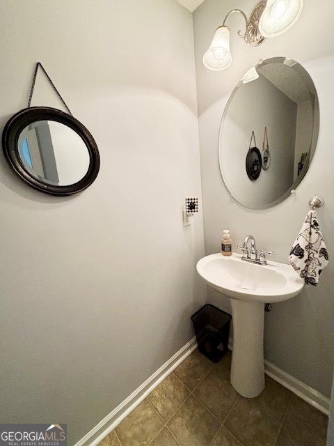 bathroom with tile patterned floors