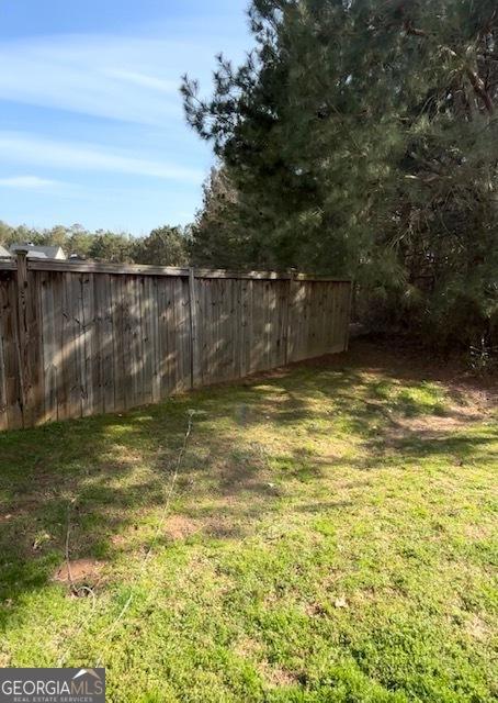 rear view of property with a yard, a pergola, and a patio