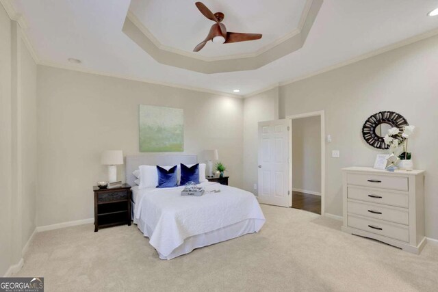 bedroom featuring ceiling fan, light colored carpet, and ornamental molding