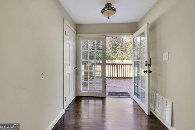 doorway to outside with dark hardwood / wood-style flooring