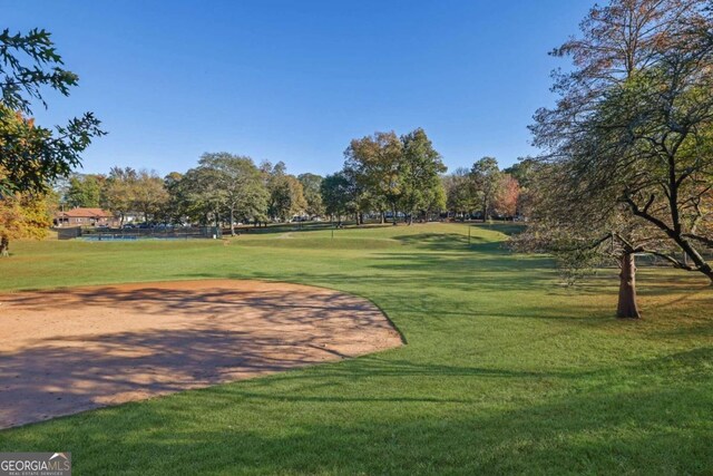 surrounding community featuring a yard