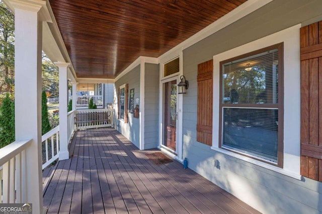 wooden terrace featuring a porch