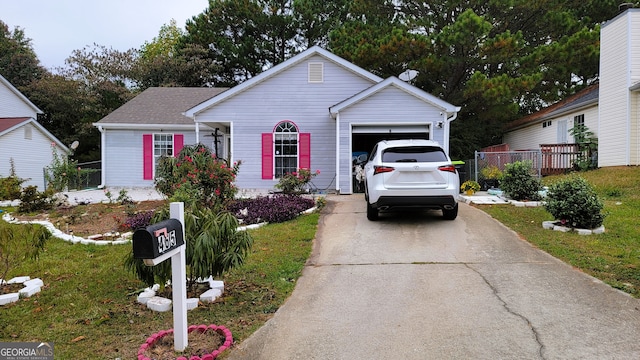 view of front of house featuring a front yard and a garage