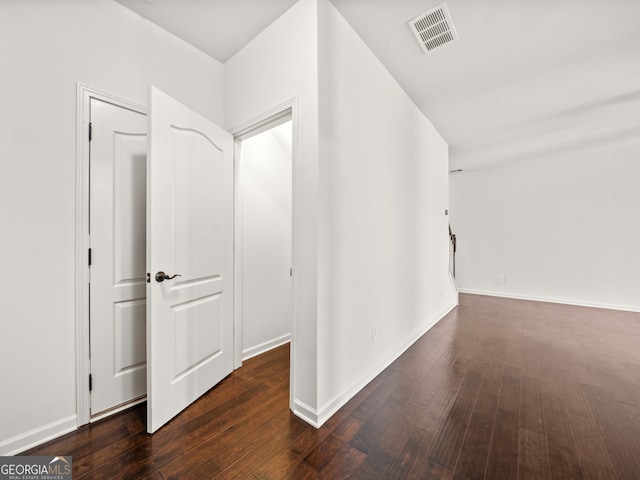 hall with dark hardwood / wood-style floors