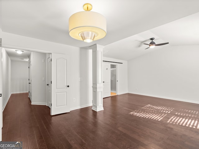 unfurnished room with ceiling fan, dark hardwood / wood-style flooring, and vaulted ceiling