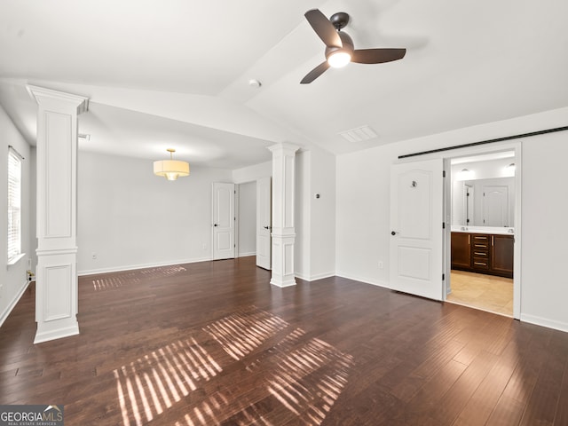 unfurnished living room with vaulted ceiling with beams, ceiling fan, wood-type flooring, and ornate columns