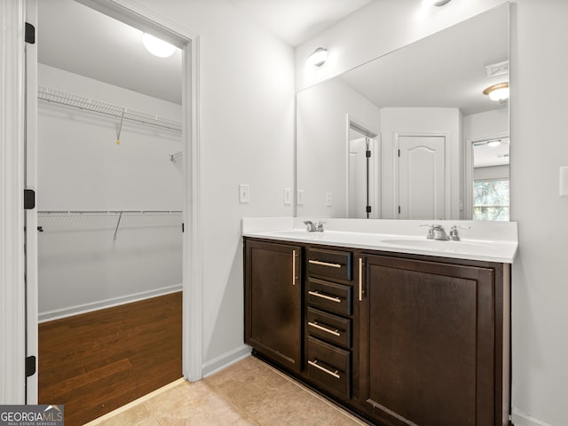 bathroom with hardwood / wood-style flooring and vanity