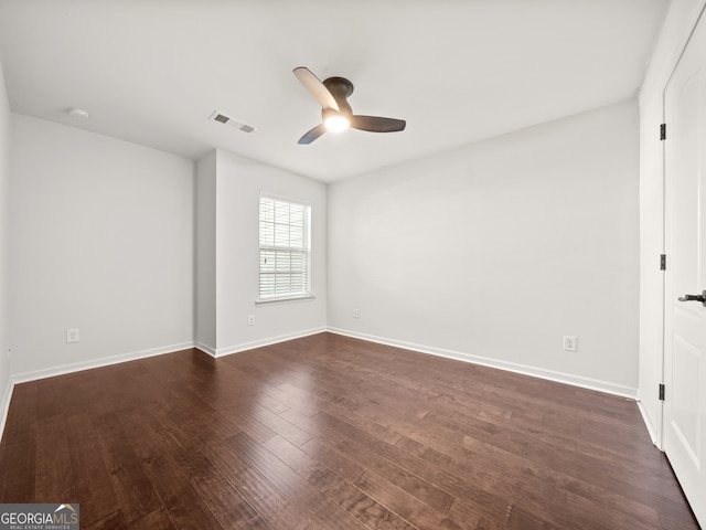 unfurnished room featuring dark hardwood / wood-style floors and ceiling fan