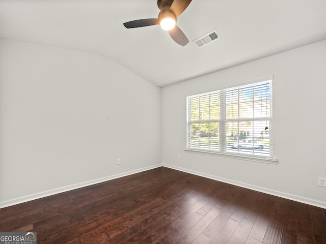 empty room with hardwood / wood-style flooring, ceiling fan, and vaulted ceiling