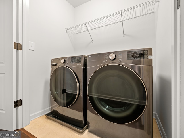 laundry room featuring independent washer and dryer