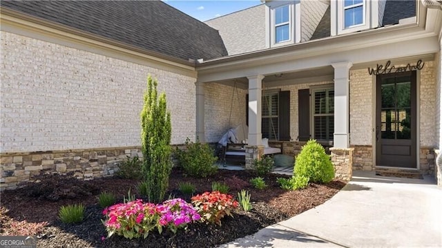 property entrance with covered porch