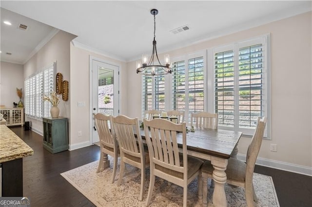 dining room with crown molding, dark hardwood / wood-style flooring, and plenty of natural light