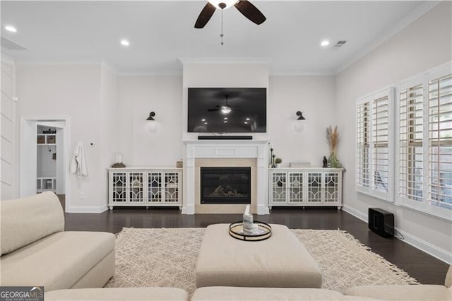 living room featuring crown molding, dark hardwood / wood-style flooring, and ceiling fan