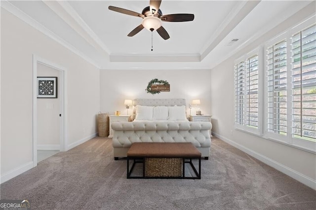 bedroom with light carpet, a raised ceiling, ceiling fan, and crown molding