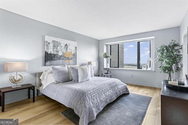 bedroom with hardwood / wood-style floors