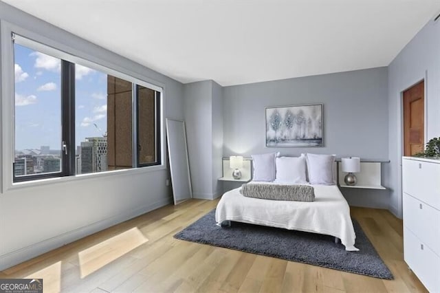 bedroom with light hardwood / wood-style flooring