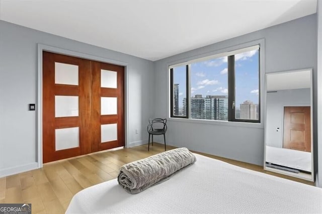 bedroom with hardwood / wood-style flooring