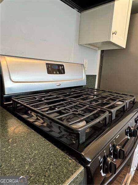 details with white cabinets and gas range