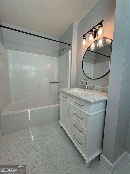 bathroom featuring vanity and tub / shower combination