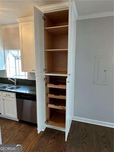 pantry featuring electric panel and sink