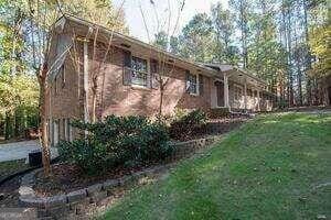 view of side of property featuring a yard