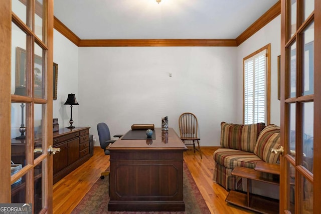 office space with french doors, hardwood / wood-style flooring, and crown molding