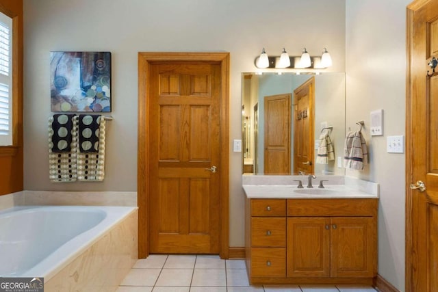 bathroom featuring vanity, tile patterned floors, and tiled tub