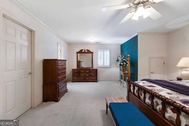 bedroom featuring ceiling fan, light carpet, and ornamental molding