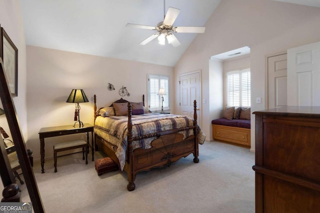 bedroom with ceiling fan, a closet, high vaulted ceiling, and light carpet