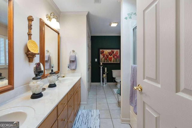 bathroom featuring toilet, vanity, tile patterned floors, and ornamental molding