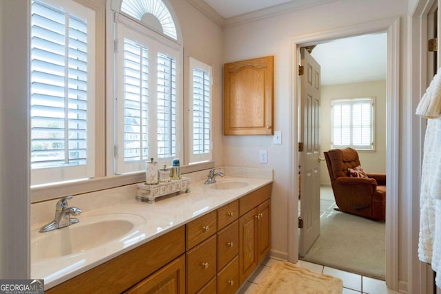 bathroom with tile patterned flooring, vanity, and ornamental molding